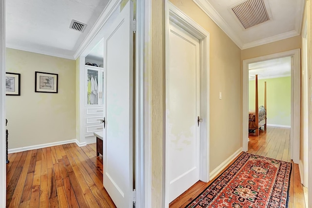 946 Paseo Morella, West Palm Beach, FL 33405 - hallway featuring light wood finished floors, ornamental molding, and baseboards