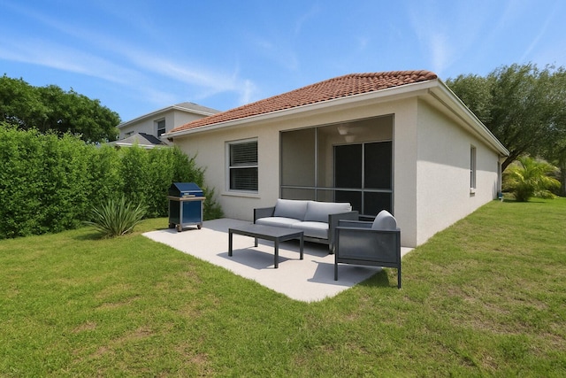 back of house with a patio area, stucco siding, a tile roof, and an outdoor hangout area