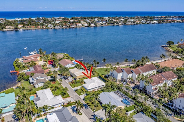 birds eye view of property featuring a residential view and a water view