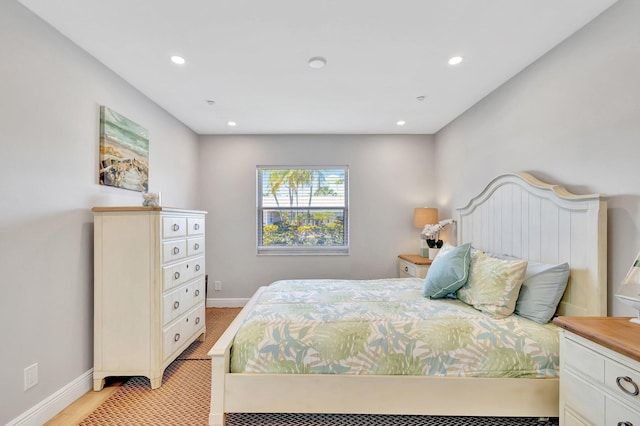 bedroom featuring baseboards and recessed lighting