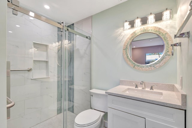 full bathroom featuring recessed lighting, vanity, a marble finish shower, and toilet