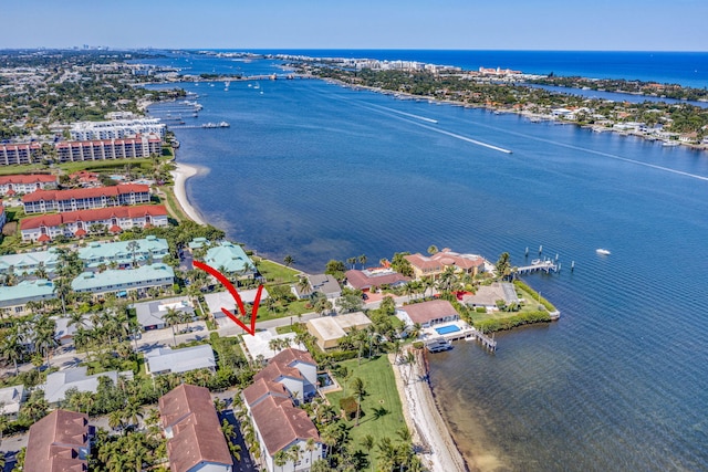 bird's eye view featuring a water view and a residential view