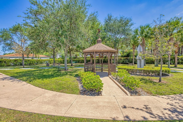 surrounding community featuring a gazebo and a lawn