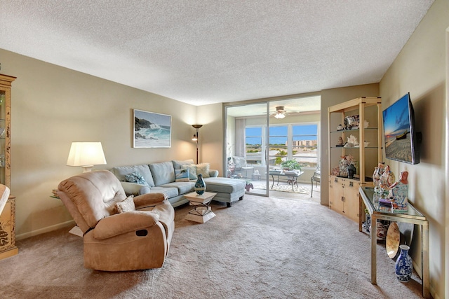 25 Abbey Ln Unit 404, Delray Beach, FL 33446 - carpeted living area with a textured ceiling and ceiling fan