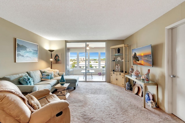 25 Abbey Ln Unit 404, Delray Beach, FL 33446 - doorway to outside with ceiling fan, light wood-style flooring, and a textured ceiling