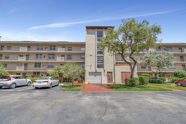 25 Abbey Ln Unit 404, Delray Beach, FL 33446 - view of apartment building / complex with uncovered parking