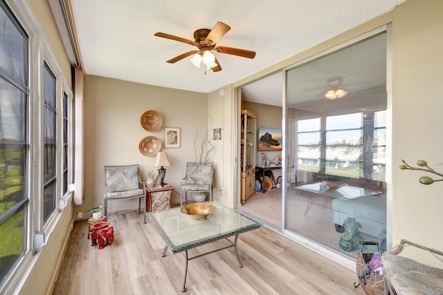 25 Abbey Ln Unit 404, Delray Beach, FL 33446 - carpeted living room featuring track lighting and a textured ceiling