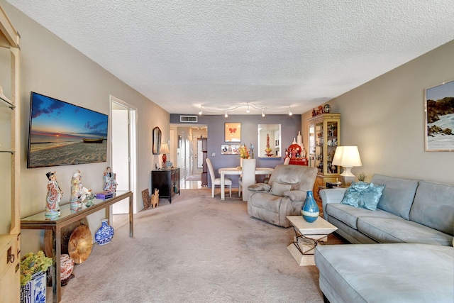 25 Abbey Ln Unit 404, Delray Beach, FL 33446 - carpeted living room featuring a textured ceiling