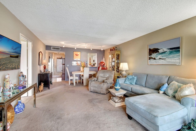 25 Abbey Ln Unit 404, Delray Beach, FL 33446 - dining room featuring light carpet, a textured ceiling, and track lighting