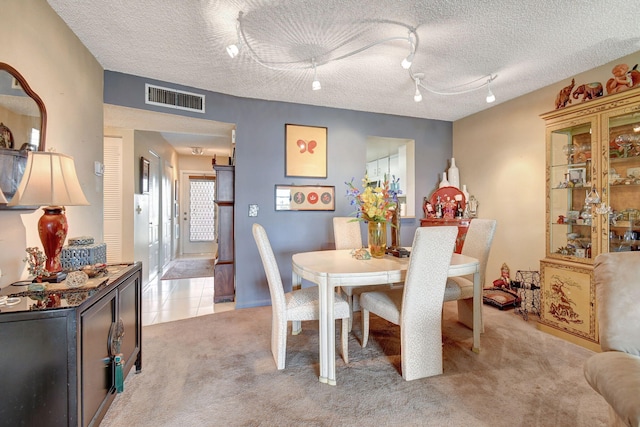 25 Abbey Ln Unit 404, Delray Beach, FL 33446 - bedroom with multiple windows, carpet flooring, a textured ceiling, and ensuite bath