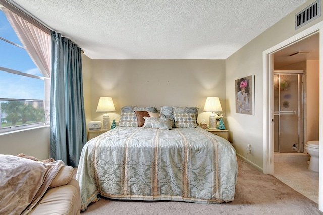 25 Abbey Ln Unit 404, Delray Beach, FL 33446 - bedroom featuring light carpet and a textured ceiling