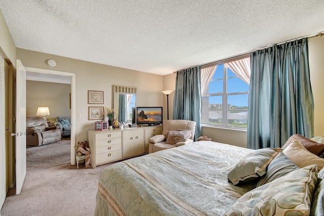 25 Abbey Ln Unit 404, Delray Beach, FL 33446 - carpeted bedroom with a textured ceiling, baseboards, and connected bathroom