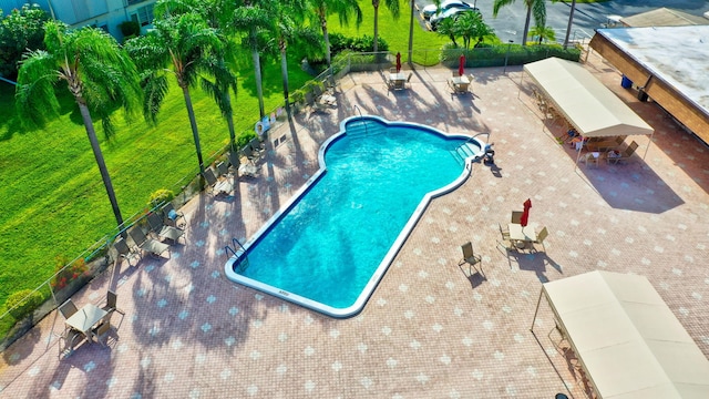 25 Abbey Ln Unit 404, Delray Beach, FL 33446 - view of patio / terrace featuring a gazebo, fence, and a community pool
