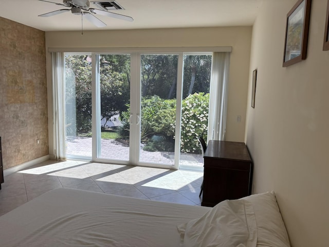doorway to outside with visible vents, tile patterned floors, baseboards, and ceiling fan