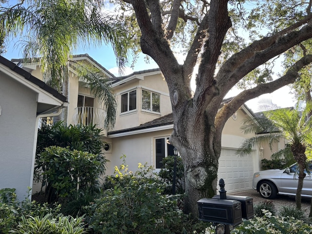 view of home's exterior with a balcony and stucco siding