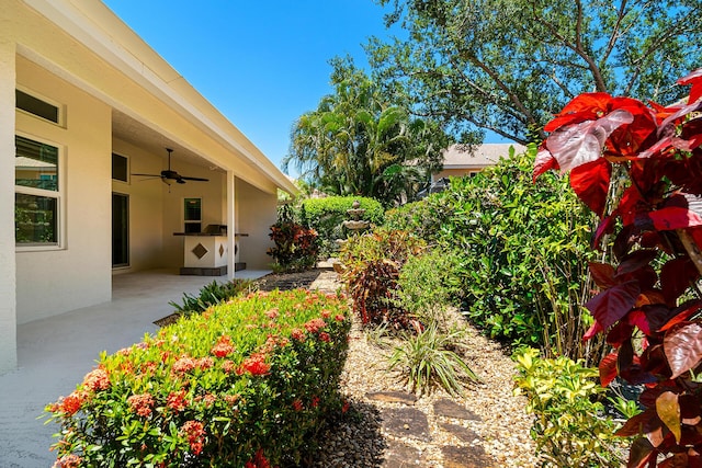 1167 Egret Cir S, Jupiter, FL 33458 - view of yard with ceiling fan and a patio