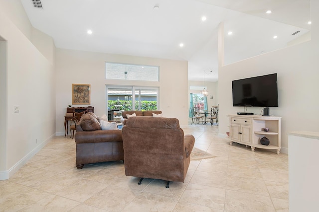 1167 Egret Cir S, Jupiter, FL 33458 - living area featuring a towering ceiling and light tile patterned floors