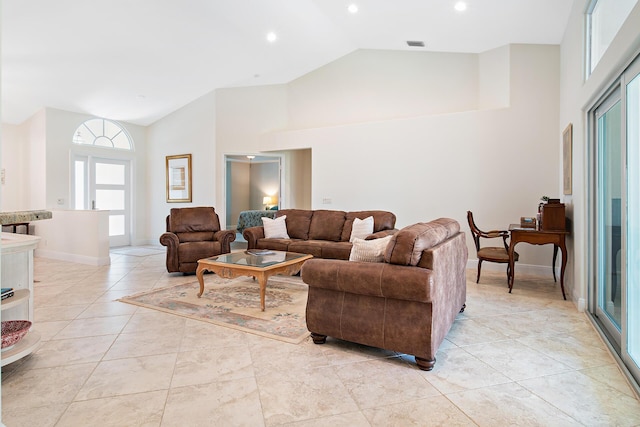 1167 Egret Cir S, Jupiter, FL 33458 - living area featuring high vaulted ceiling, recessed lighting, and light tile patterned flooring