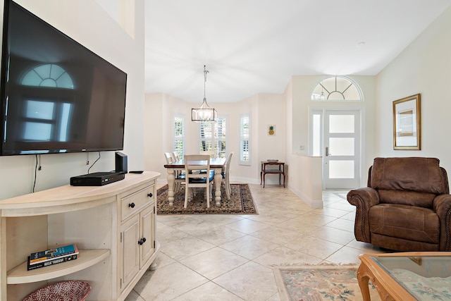 1167 Egret Cir S, Jupiter, FL 33458 - living room featuring baseboards and a chandelier