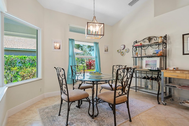 1167 Egret Cir S, Jupiter, FL 33458 - tiled dining area with a chandelier and baseboards