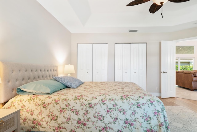 1167 Egret Cir S, Jupiter, FL 33458 - bedroom featuring multiple closets, wood finished floors, and a ceiling fan