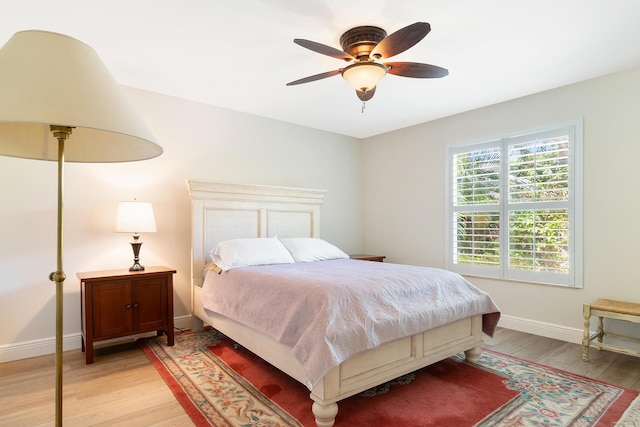 1167 Egret Cir S, Jupiter, FL 33458 - bedroom with light wood-type flooring and a ceiling fan