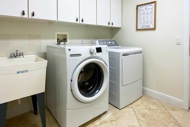 1167 Egret Cir S, Jupiter, FL 33458 - laundry room with washer and clothes dryer and cabinet space