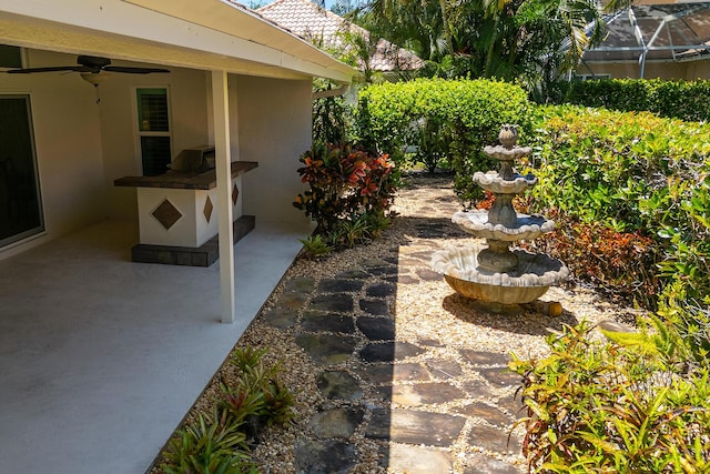 1167 Egret Cir S, Jupiter, FL 33458 - view of yard with ceiling fan and a patio