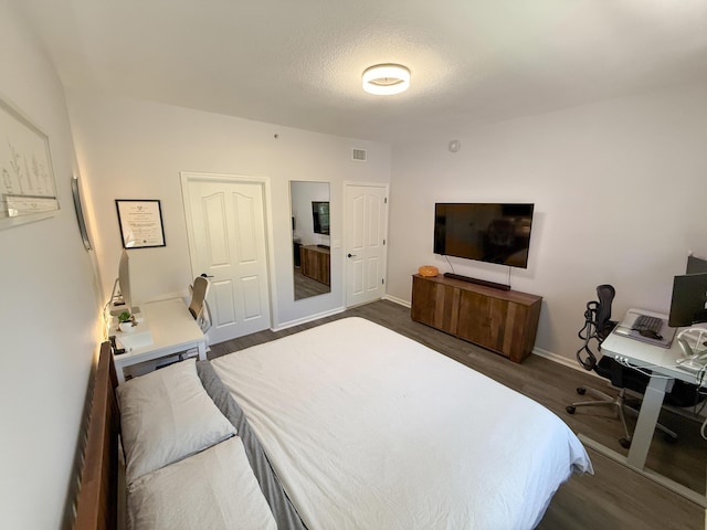 275 Murcia Dr Unit 304, Jupiter, FL 33458 - bedroom featuring dark wood-style flooring, an office area, and baseboards