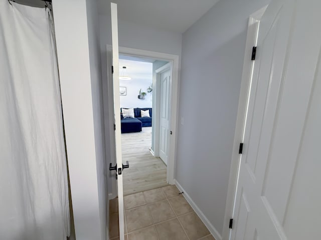 275 Murcia Dr Unit 304, Jupiter, FL 33458 - hall with light tile patterned floors and baseboards