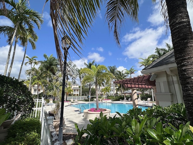 275 Murcia Dr Unit 304, Jupiter, FL 33458 - community pool featuring a pergola and a patio area