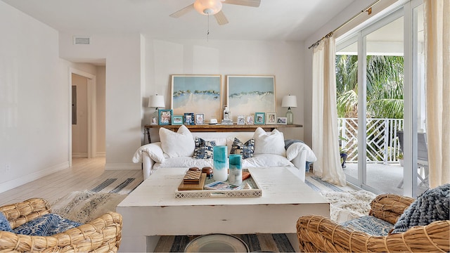 dining area featuring wood finished floors, visible vents, baseboards, and ceiling fan
