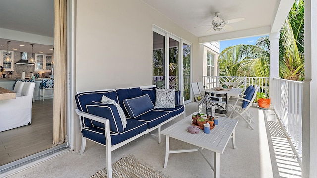 exterior space with ceiling fan and an outdoor hangout area