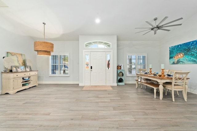 entrance foyer featuring baseboards, light wood finished floors, plenty of natural light, and ceiling fan