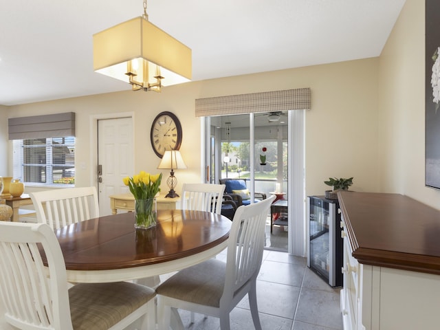 14586 Lucy Dr, Delray Beach, FL 33484 - dining room featuring light tile patterned floors, beverage cooler, and plenty of natural light
