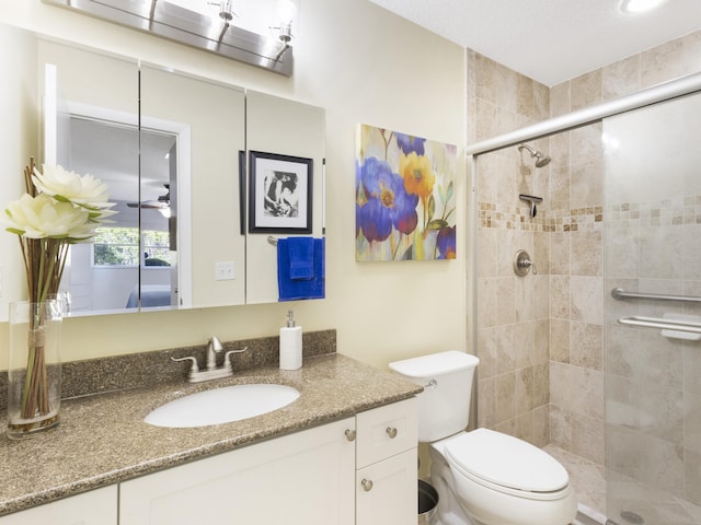 14586 Lucy Dr, Delray Beach, FL 33484 - bathroom featuring toilet, vanity, and a stall shower