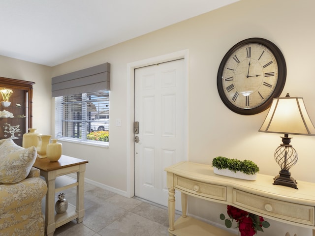 14586 Lucy Dr, Delray Beach, FL 33484 - entryway featuring baseboards and light tile patterned flooring