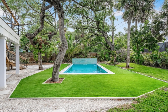 view of pool featuring a yard, a fenced in pool, a patio, and a fenced backyard
