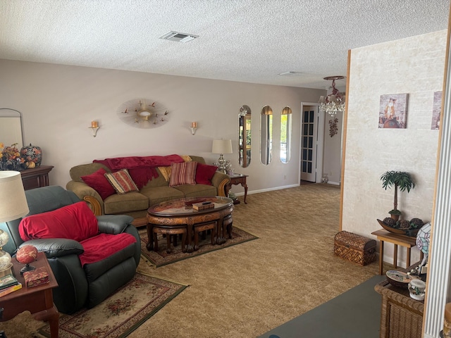 living room featuring carpet floors and a textured ceiling