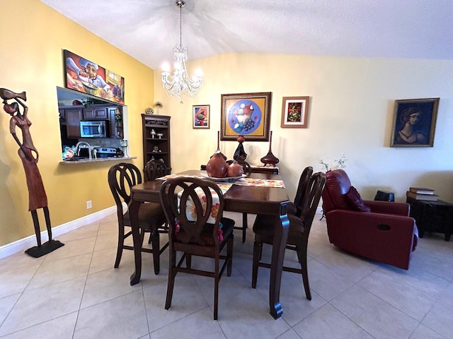 4330 Lucerne Villas Ln, Lake Worth, FL 33467 - dining room featuring baseboards, a notable chandelier, and light tile patterned floors