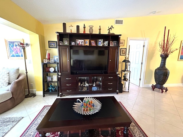 4330 Lucerne Villas Ln, Lake Worth, FL 33467 - living room with visible vents, baseboards, a textured ceiling, and light tile patterned floors