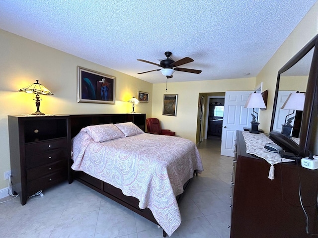 4330 Lucerne Villas Ln, Lake Worth, FL 33467 - bedroom featuring a textured ceiling, ceiling fan, and light tile patterned floors