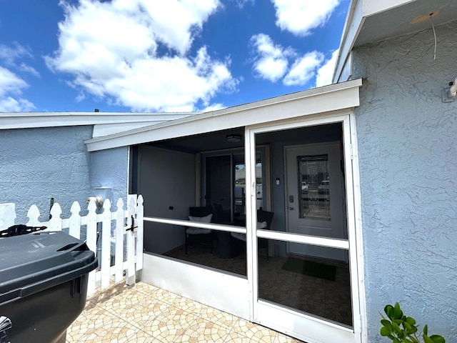 4330 Lucerne Villas Ln, Lake Worth, FL 33467 - property entrance featuring fence and stucco siding