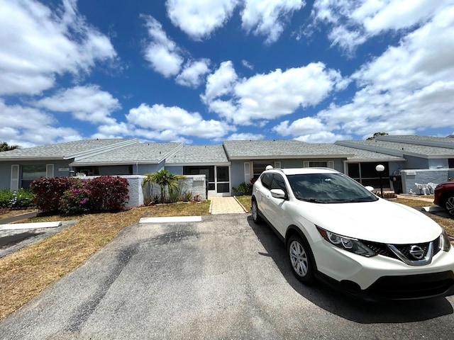 4330 Lucerne Villas Ln, Lake Worth, FL 33467 - view of front of house with stucco siding and uncovered parking
