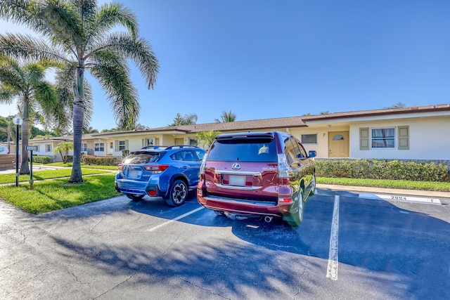 2894 Crosley Dr E Unit G, West Palm Beach, FL 33415 - view of front facade featuring uncovered parking