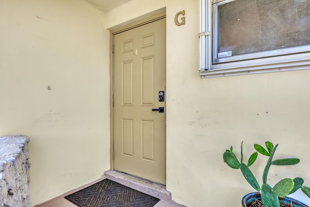 2894 Crosley Dr E Unit G, West Palm Beach, FL 33415 - view of exterior entry with stucco siding