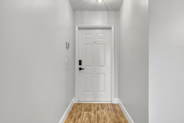 2894 Crosley Dr E Unit G, West Palm Beach, FL 33415 - doorway with baseboards and light wood finished floors