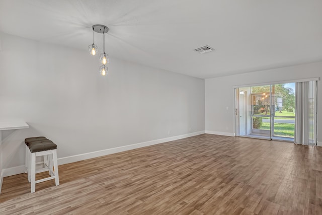 2894 Crosley Dr E Unit G, West Palm Beach, FL 33415 - unfurnished room with baseboards, visible vents, and light wood finished floors