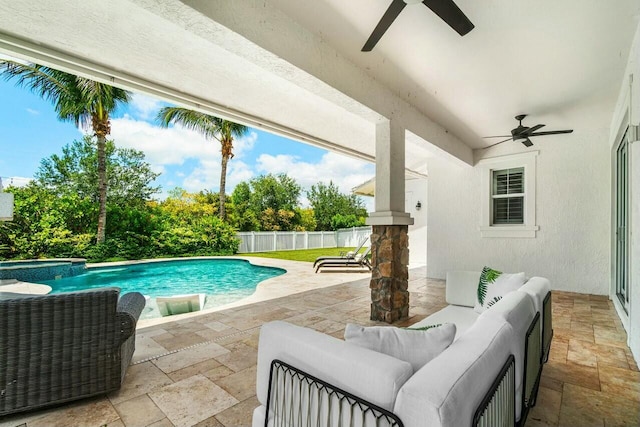 view of pool featuring ceiling fan, a patio, an outdoor living space, and a fenced backyard