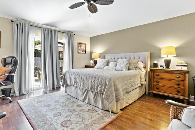 bedroom with access to outside, a ceiling fan, and wood finished floors